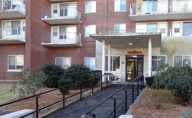 Exterior view of the Sawyer Towers entrance with landscaping