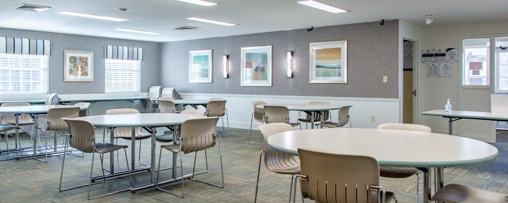 Bright common area with table seating for activities