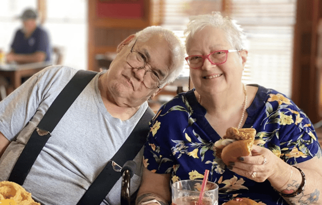 Two residents enjoying a meal together in a common area