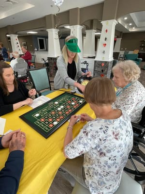 Residents enjoying a game of roulette in a common area