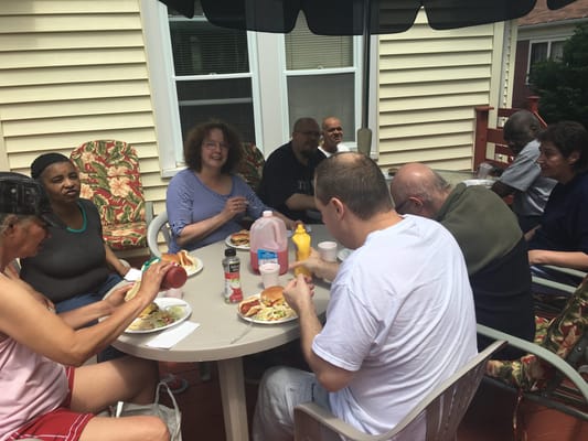 Residents enjoying a meal together outside