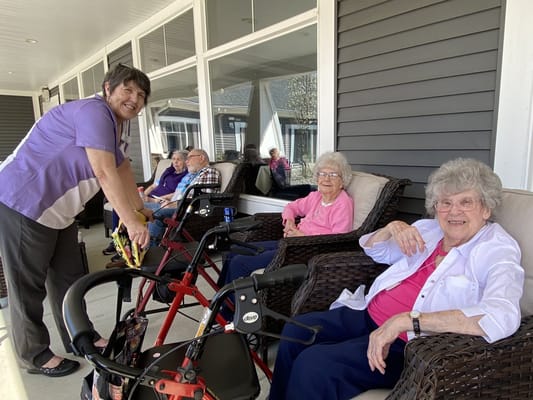 Residents enjoying time outdoors with staff members