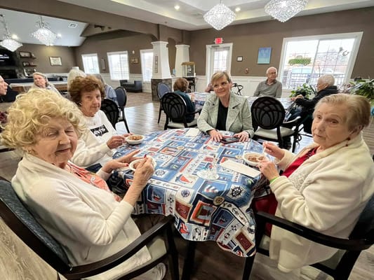 Residents enjoying snacks at a social gathering