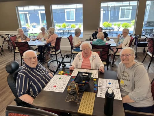 Residents playing bingo in an activity area