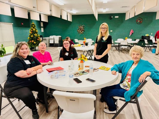 Residents and staff interacting in a common area