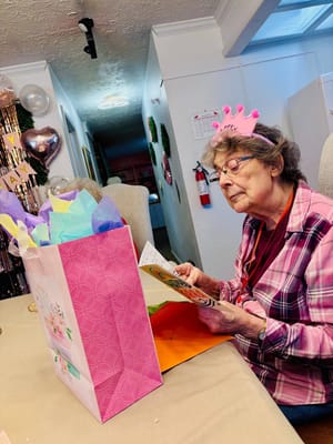 Resident celebrating a birthday with gifts and decorations