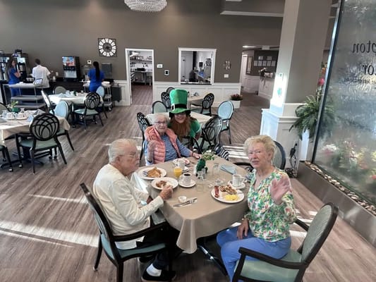 Residents enjoying a meal in the dining room