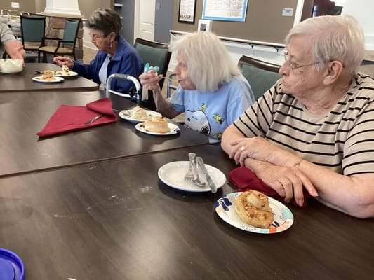 Residents enjoying a meal in the dining room