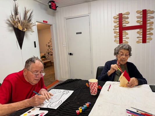 Residents engaged in arts and crafts activity