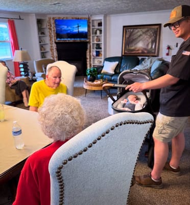 Residents and staff interacting in a cozy common area