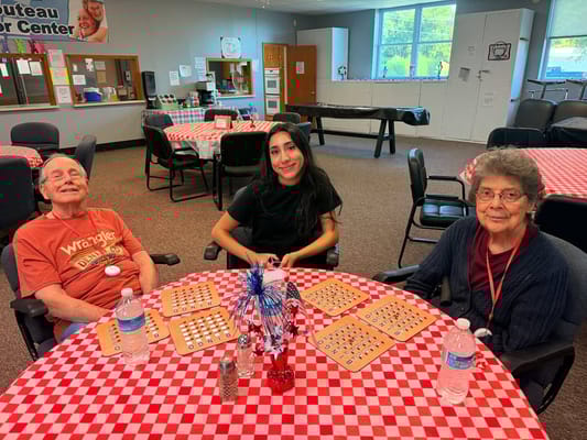 Residents enjoying bingo in a social area.