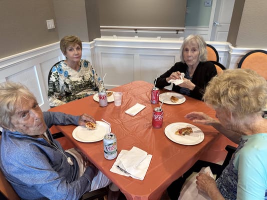 Residents enjoying a meal together at a table