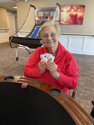 Resident enjoying a card game in a common area