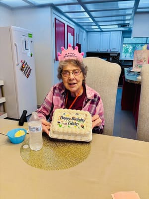 Resident celebrating birthday with cake