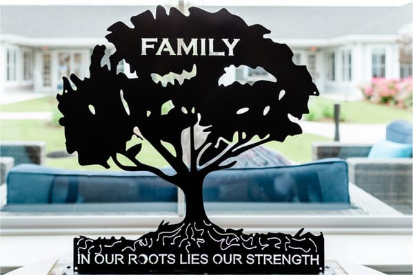 Decorative family-themed metal art piece inside the facility