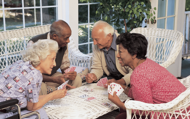 Residents playing cards in a common area