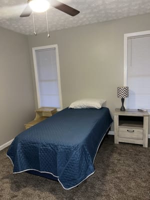Cozy resident room with a bed and furniture