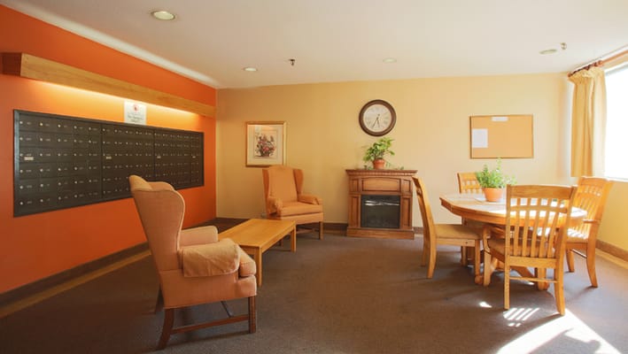 Cozy common area with seating and mailboxes
