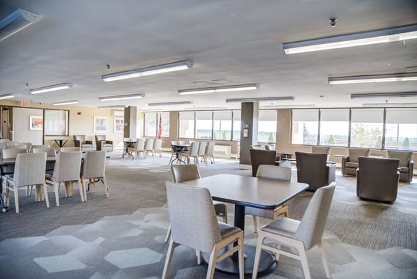Bright common area with seating and tables