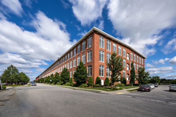 Exterior view of a red brick building with windows