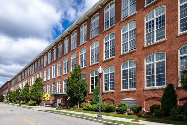 Exterior view of a large brick building with windows