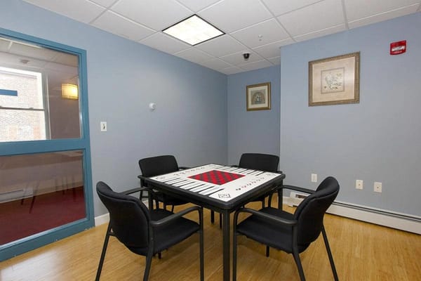 Indoor common area with tables and chairs