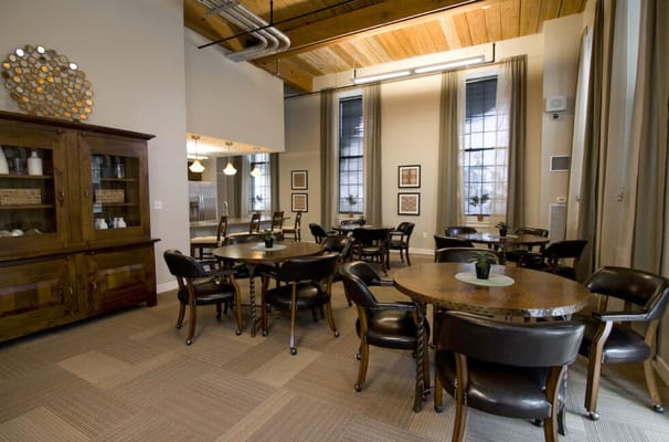 Bright and inviting common area with tables and chairs