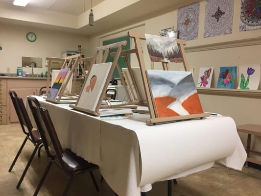 Art easels set up in a senior living facility's art studio.