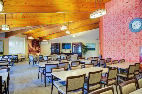Interior view of a dining area with tables and chairs