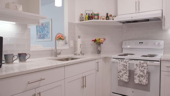 Bright kitchen area with modern appliances and decor