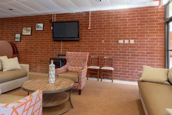 Cozy common area with seating and TV