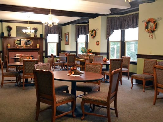 Cozy dining area with tables and chairs
