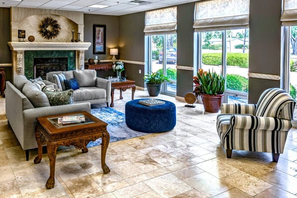 Bright common area with sofas and plants