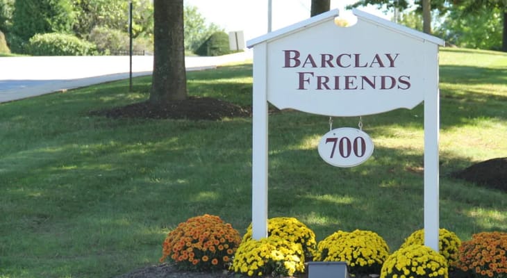Sign for Barclay Friends with colorful flowers