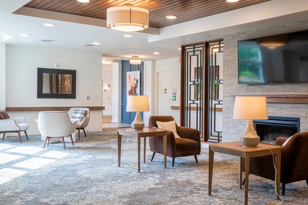 Bright common area with seating and light decor