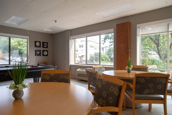 Common area with tables and a pool table