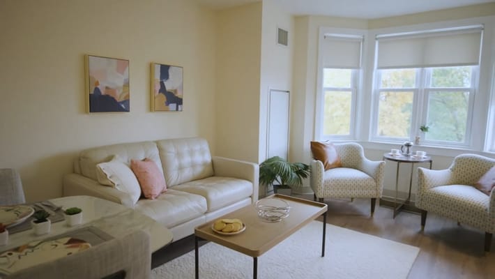 Bright living room with seating and decorative art