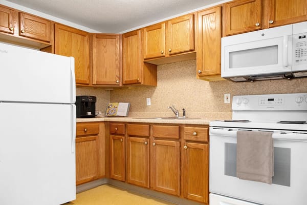 Well-equipped kitchen area with wooden cabinets