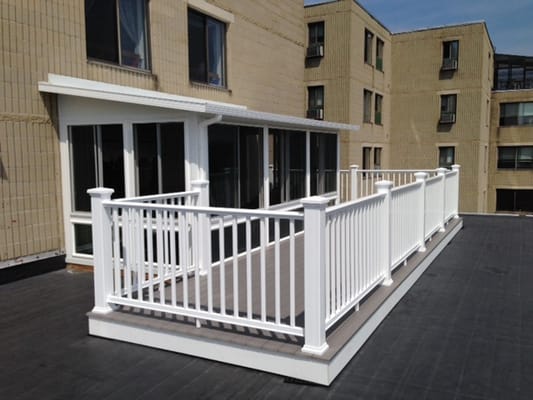 Rooftop patio with white railing