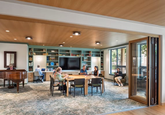 Residents engaging in various activities in a common area