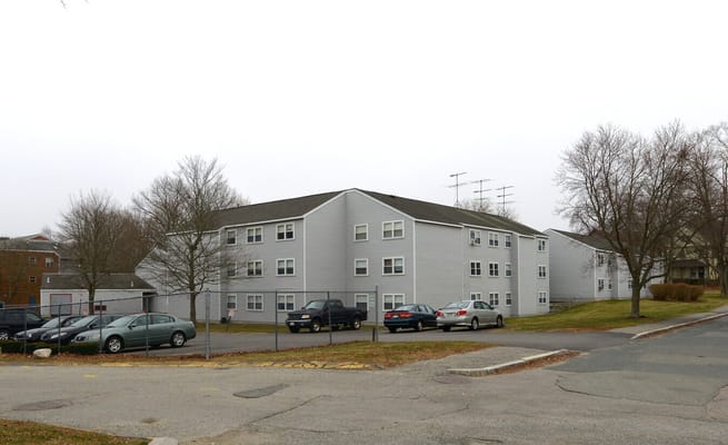 View of the exterior of John Shea Court with parking area.