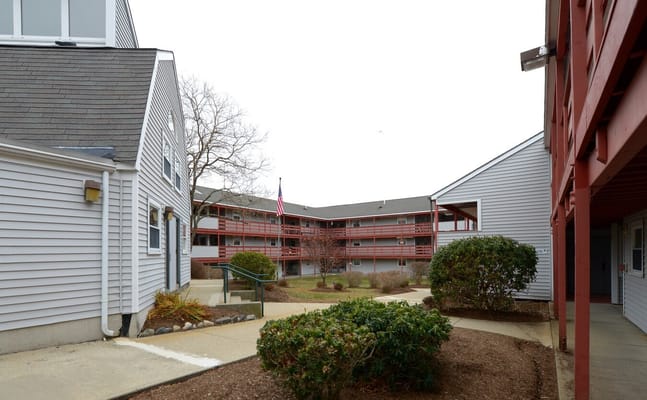 View of the courtyard at John Shea Court with landscaping and buildings
