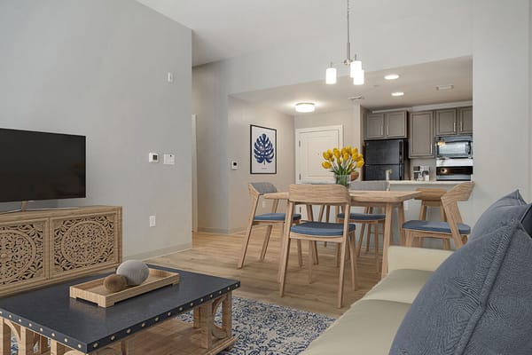 Bright living area with a dining table and kitchen