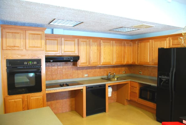 Spacious kitchen with wooden cabinets and modern appliances