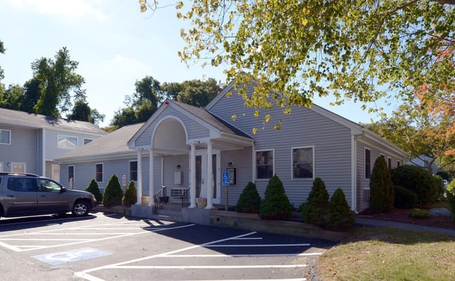 Exterior view of Highland Hills facility with parking