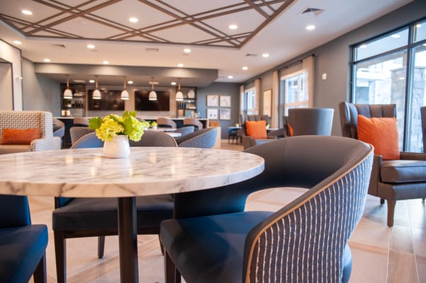 A modern common area with seating and decor