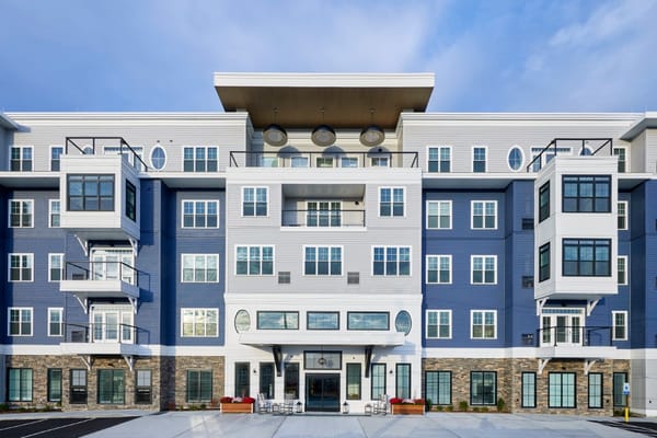 Modern exterior of The Current South Shore senior living facility