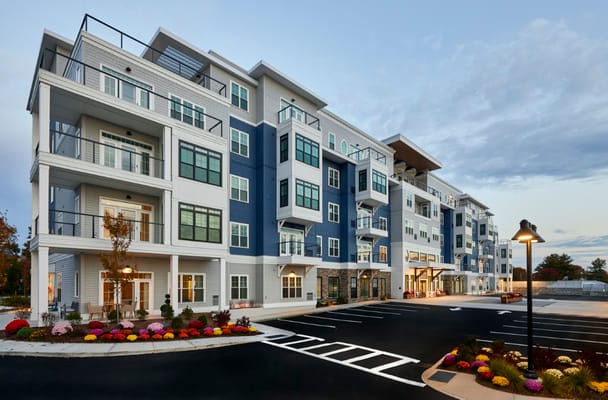 Exterior view of The Current South Shore building with landscaping