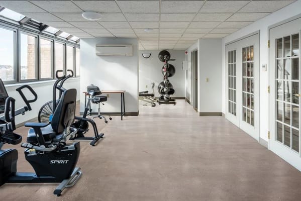 Interior view of a gym area with exercise equipment