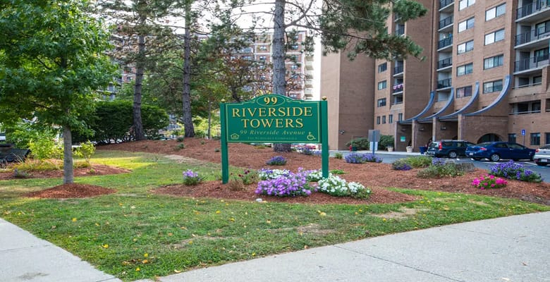 Exterior view of Riverside Towers with landscaping